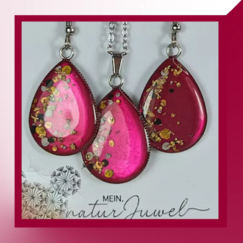 Handgetupftes Schmuckset in Tropfenform, kräftiges Rot, aus Edelstahl und Epoxidharz.